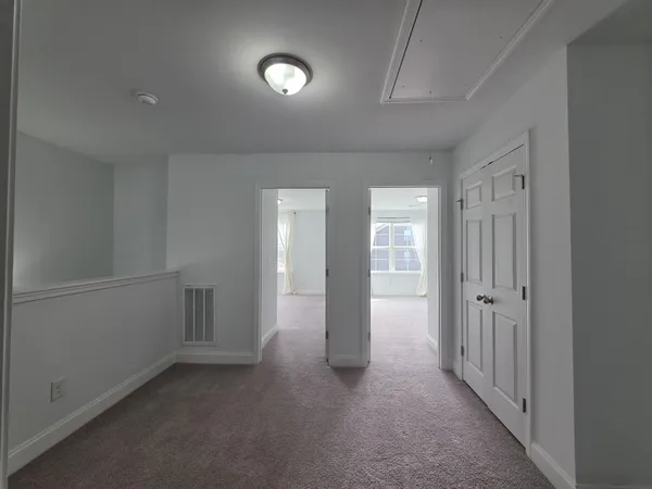 a view of a livingroom with wooden floor