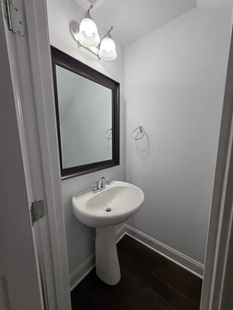 a bathroom with a sink a mirror and vanity