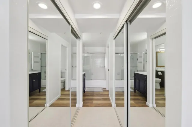 a bathroom with a shower and closet