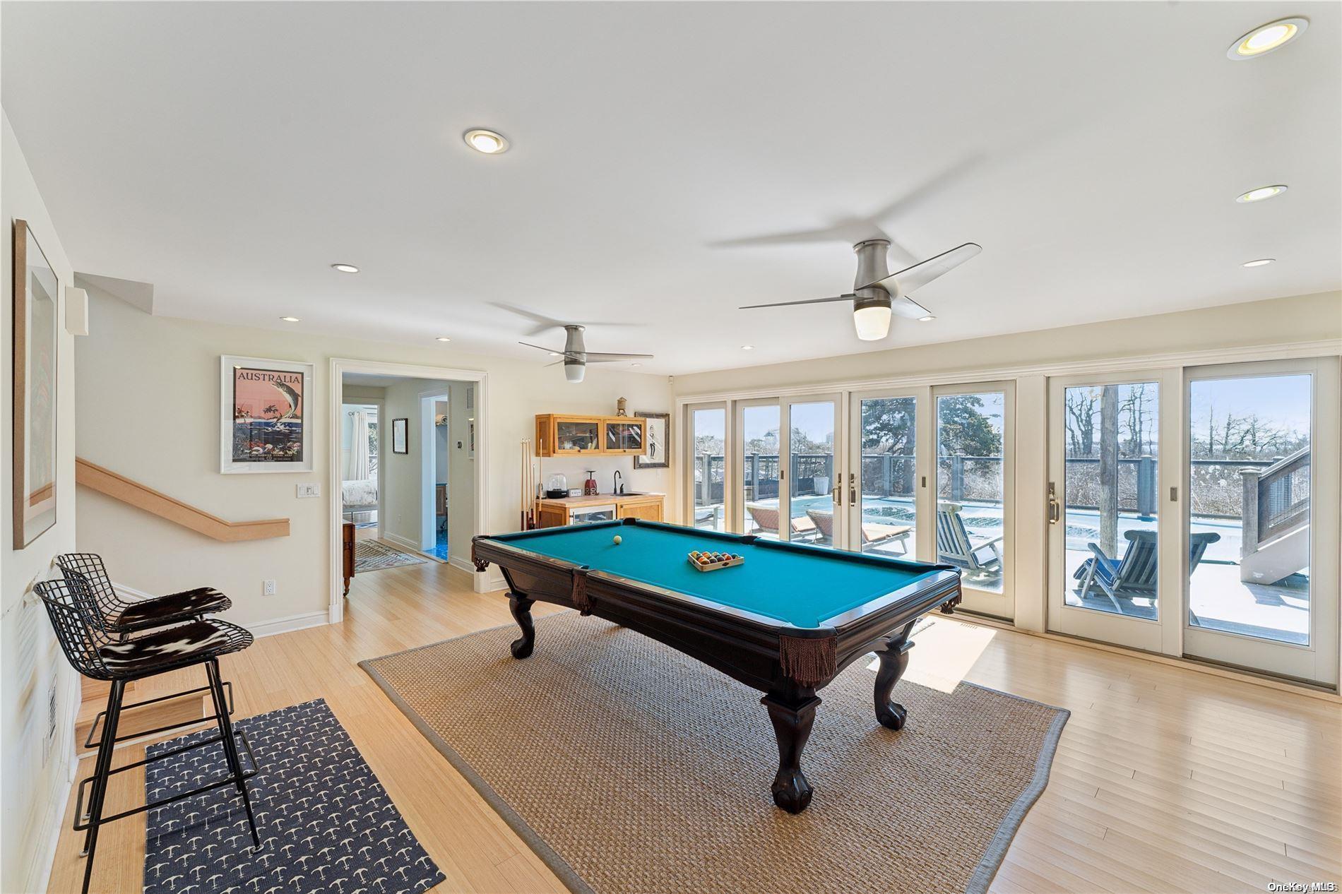 32 Tuthill Lane Remsenburg, NY 11960 - Photo 15 of 32 a room with pool table and windows