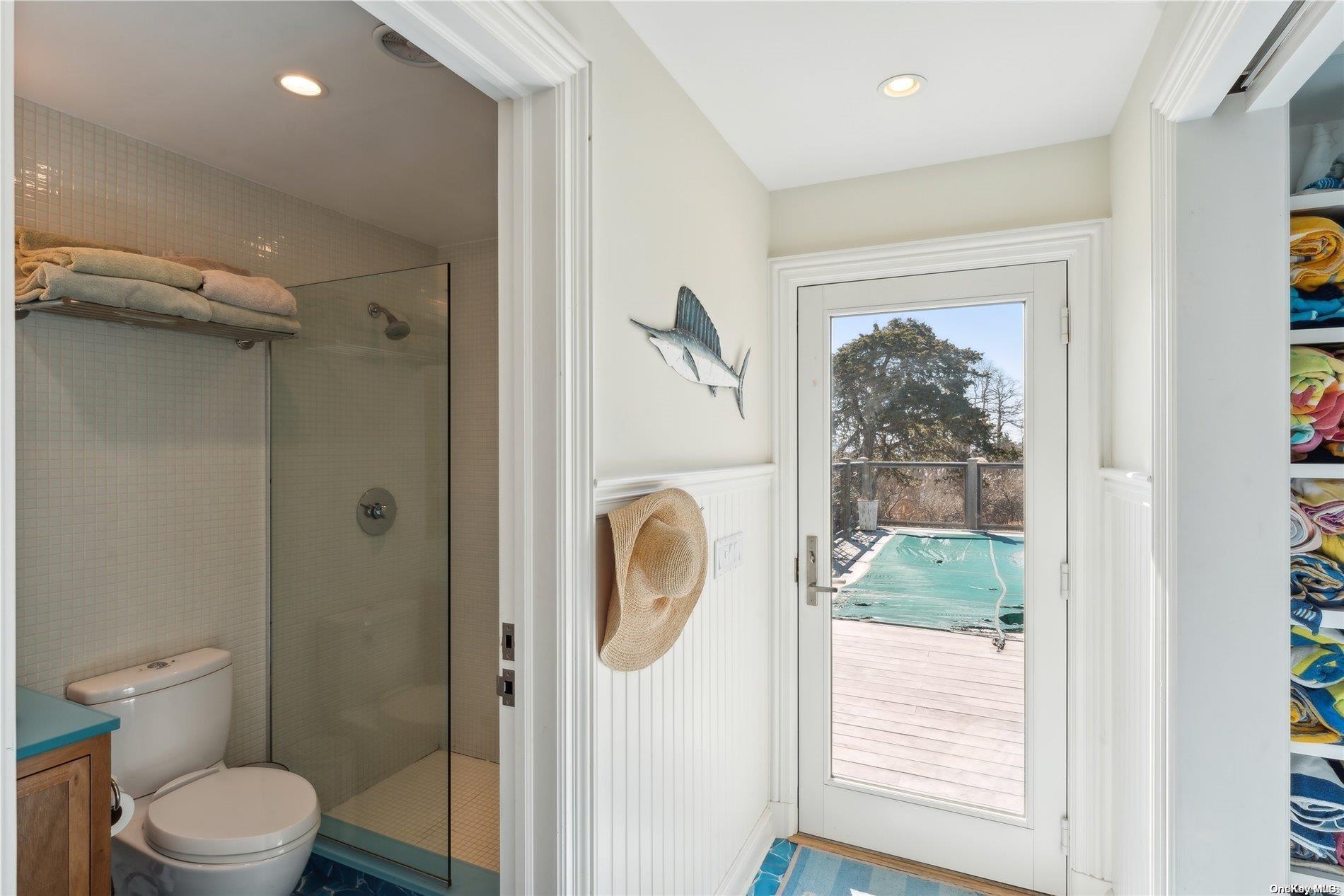 32 Tuthill Lane Remsenburg, NY 11960 - Photo 22 of 32 a bathroom with a toilet a sink and a shower