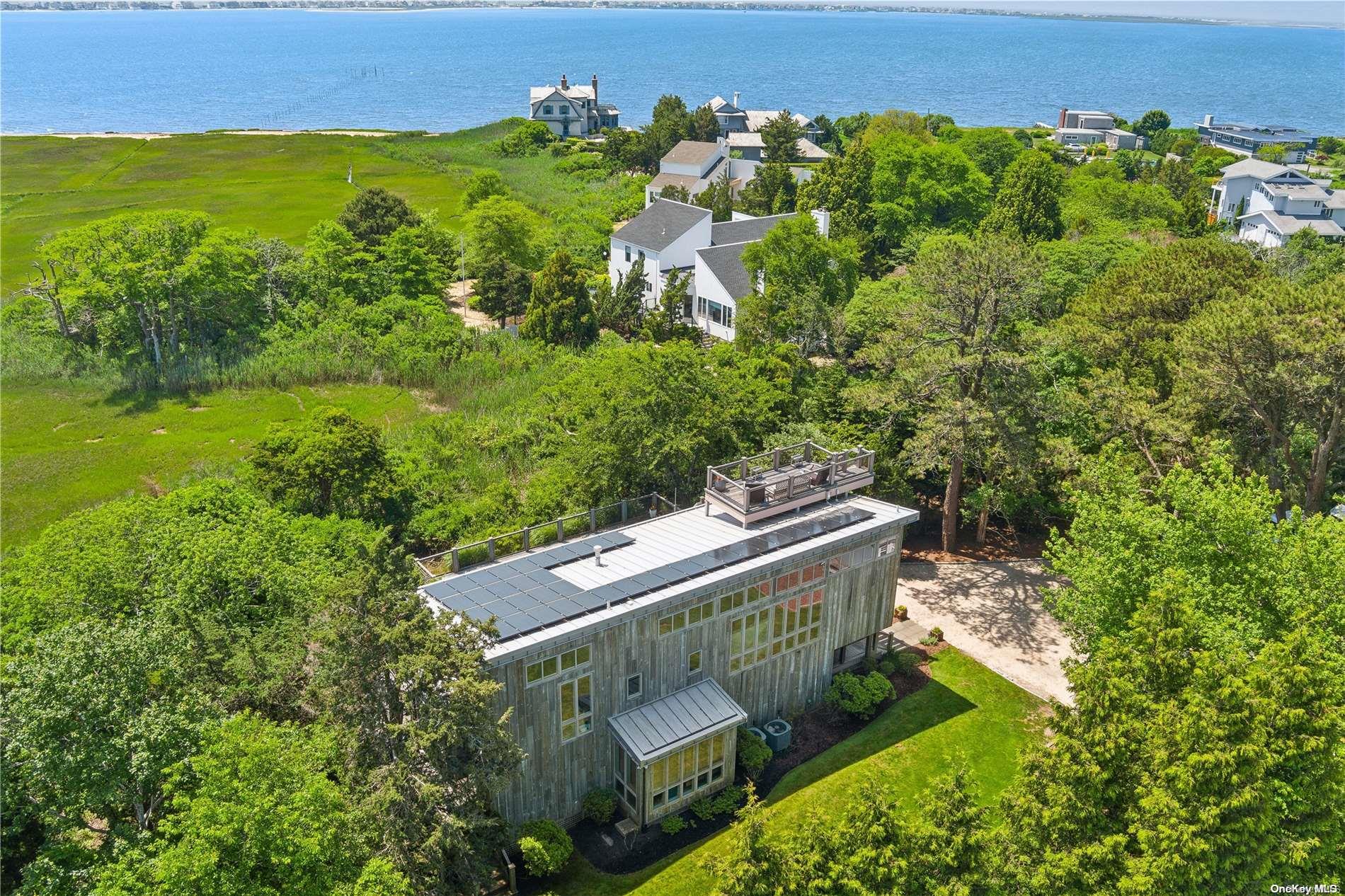 32 Tuthill Lane Remsenburg, NY 11960 - Photo 26 of 32 a view of a garden with an outdoor space
