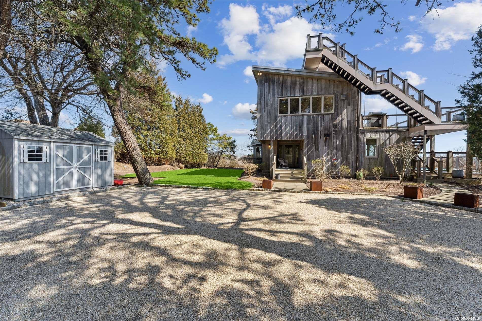 32 Tuthill Lane Remsenburg, NY 11960 - Photo 27 of 32 a view of a building with a street