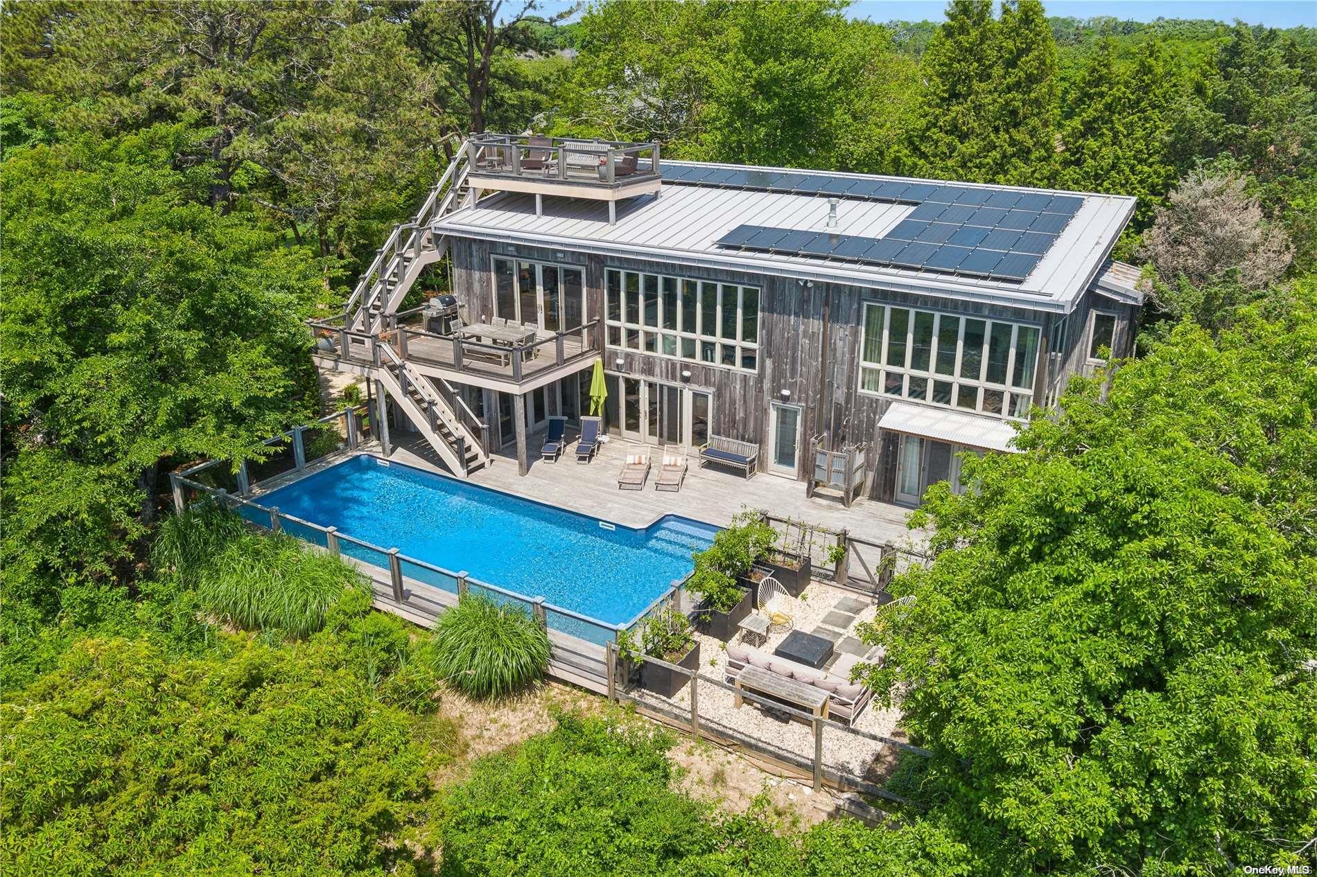 32 Tuthill Lane Remsenburg, NY 11960 - Photo 30 of 32 a view of a house with a yard