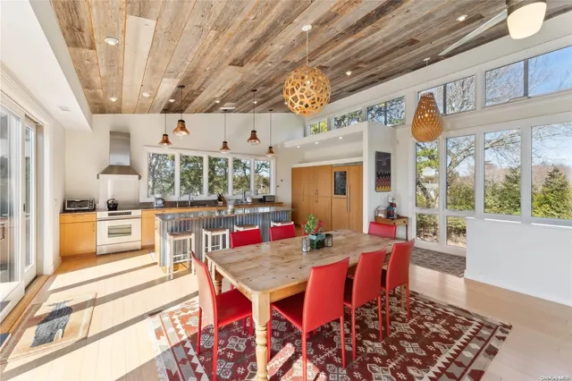 a outdoor dining space with furniture and wooden floor
