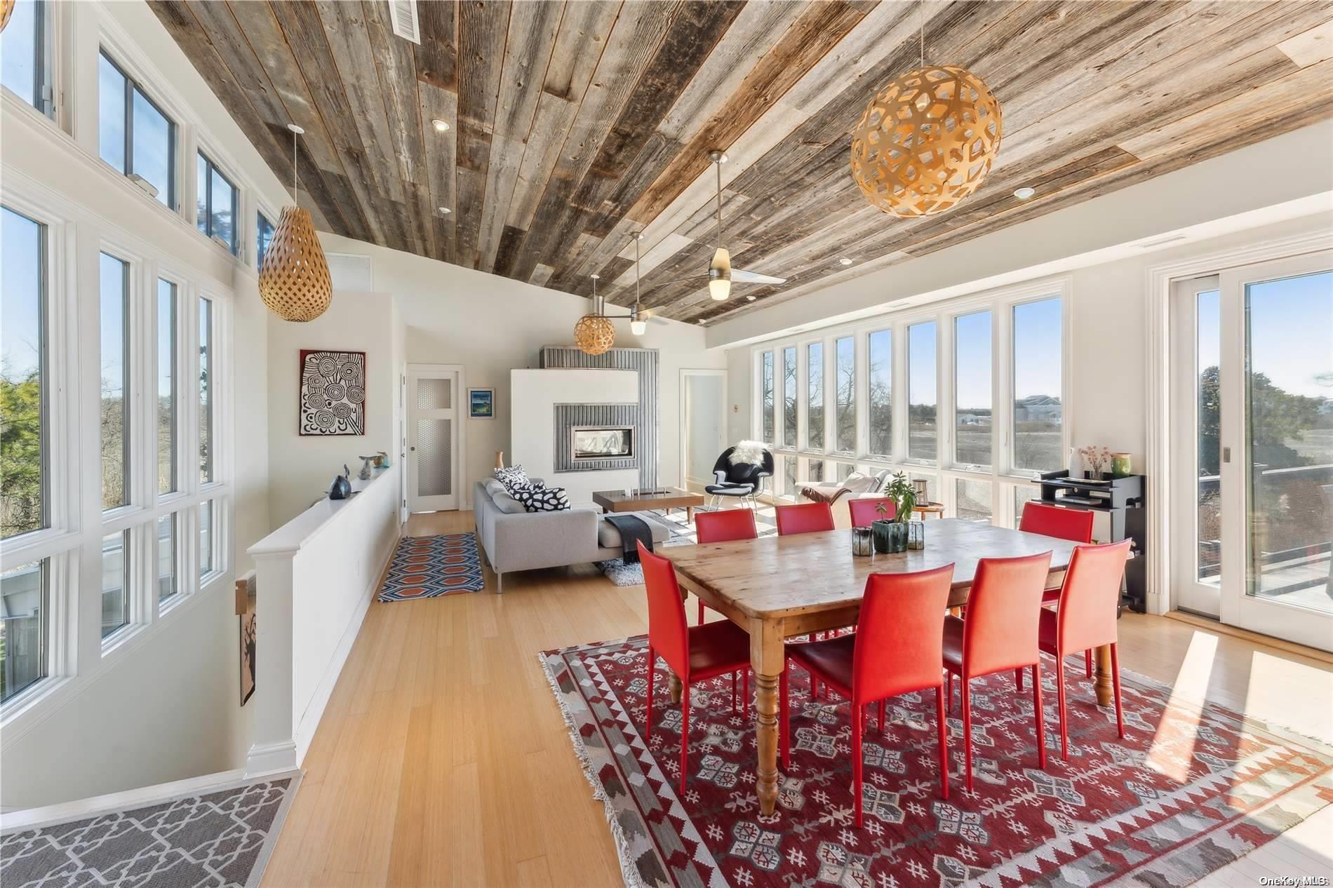 32 Tuthill Lane Remsenburg, NY 11960 - Photo 9 of 32 a dining room with furniture and a large window