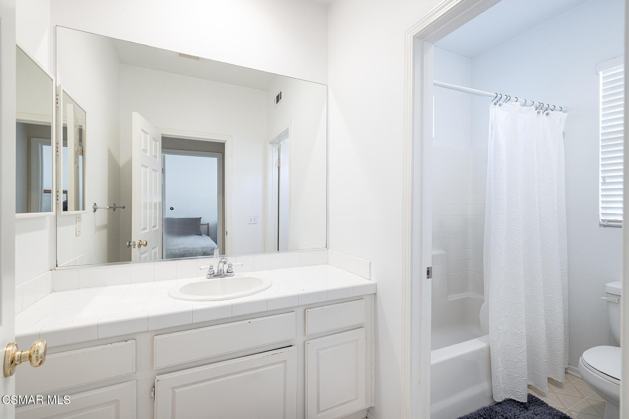 2684 Sunshine Valley Court Simi Valley, CA 93063 - Photo 14 of 38 a bathroom with a sink a toilet a shower and a mirror