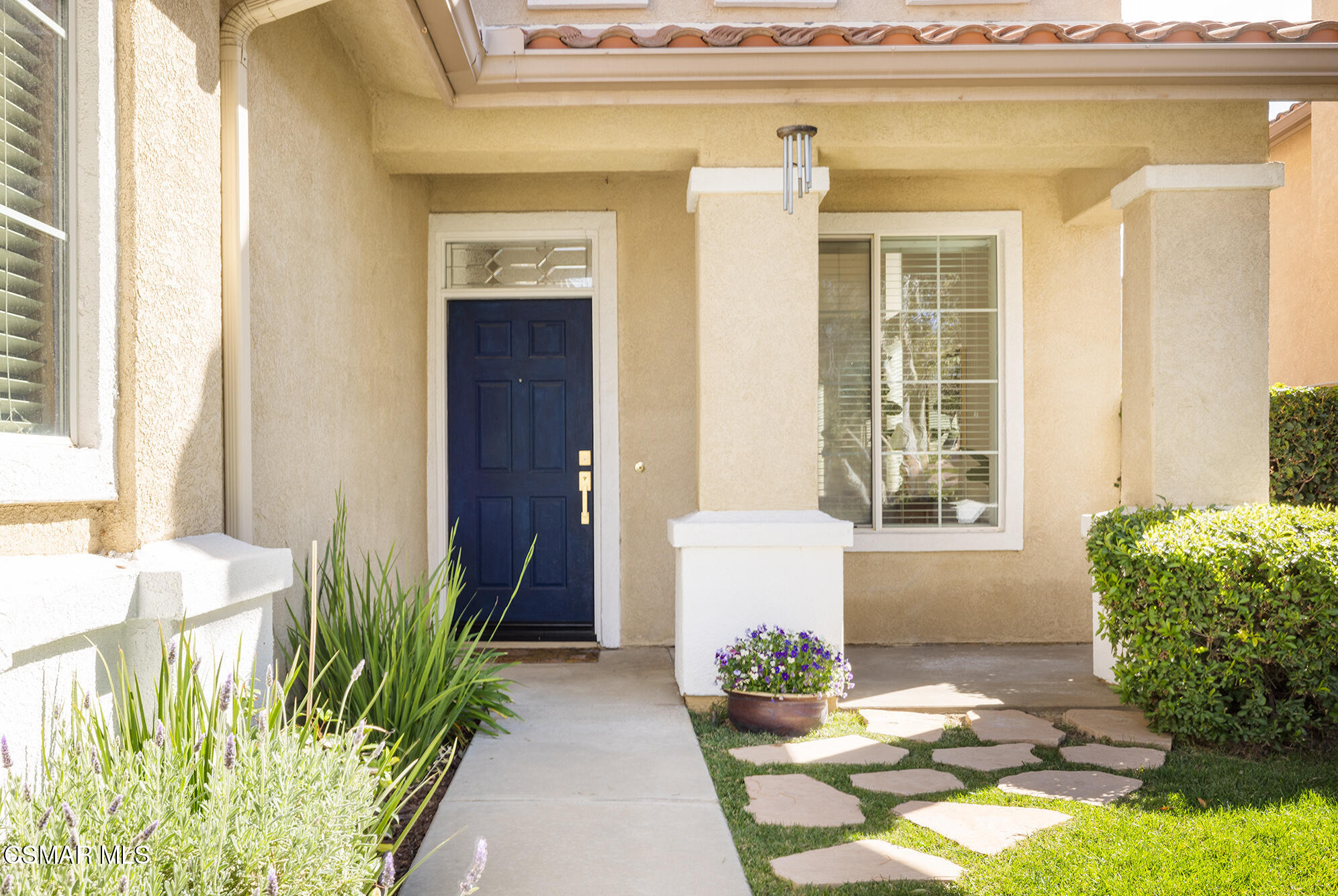 2684 Sunshine Valley Court Simi Valley, CA 93063 - Photo 19 of 38 a front view of a house with a garden