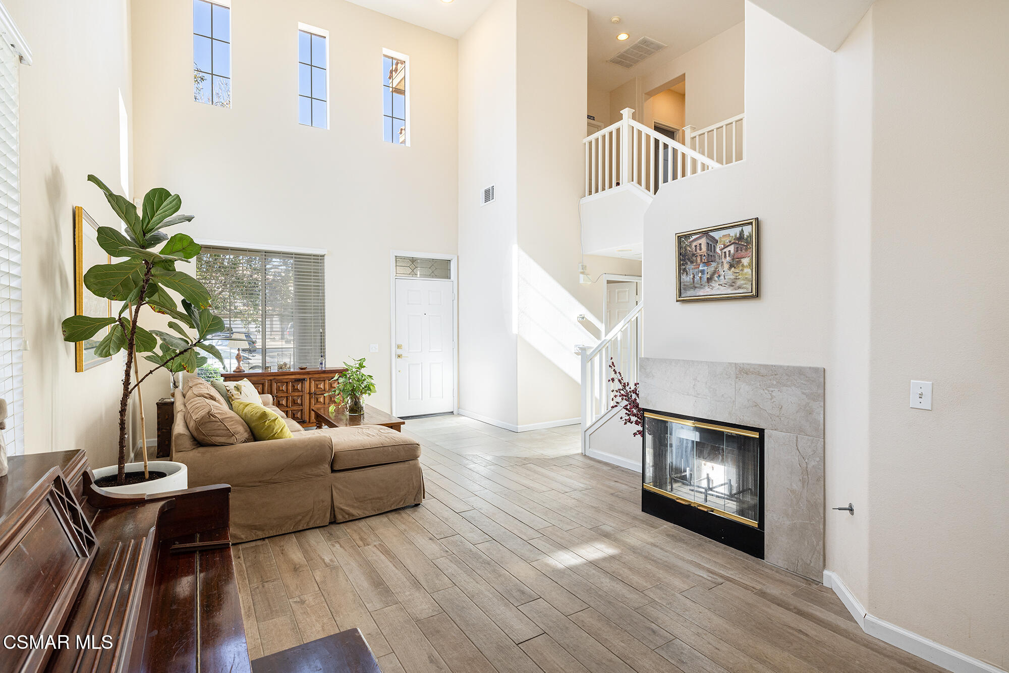 2684 Sunshine Valley Court Simi Valley, CA 93063 - Photo 2 of 38 a living room with furniture and a fireplace