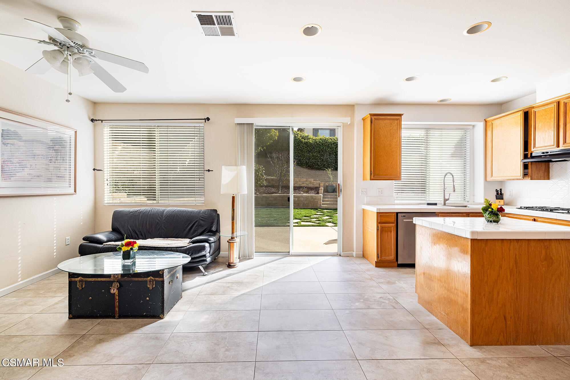 2684 Sunshine Valley Court Simi Valley, CA 93063 - Photo 25 of 38 a living room with kitchen appliances furniture and a flat screen tv