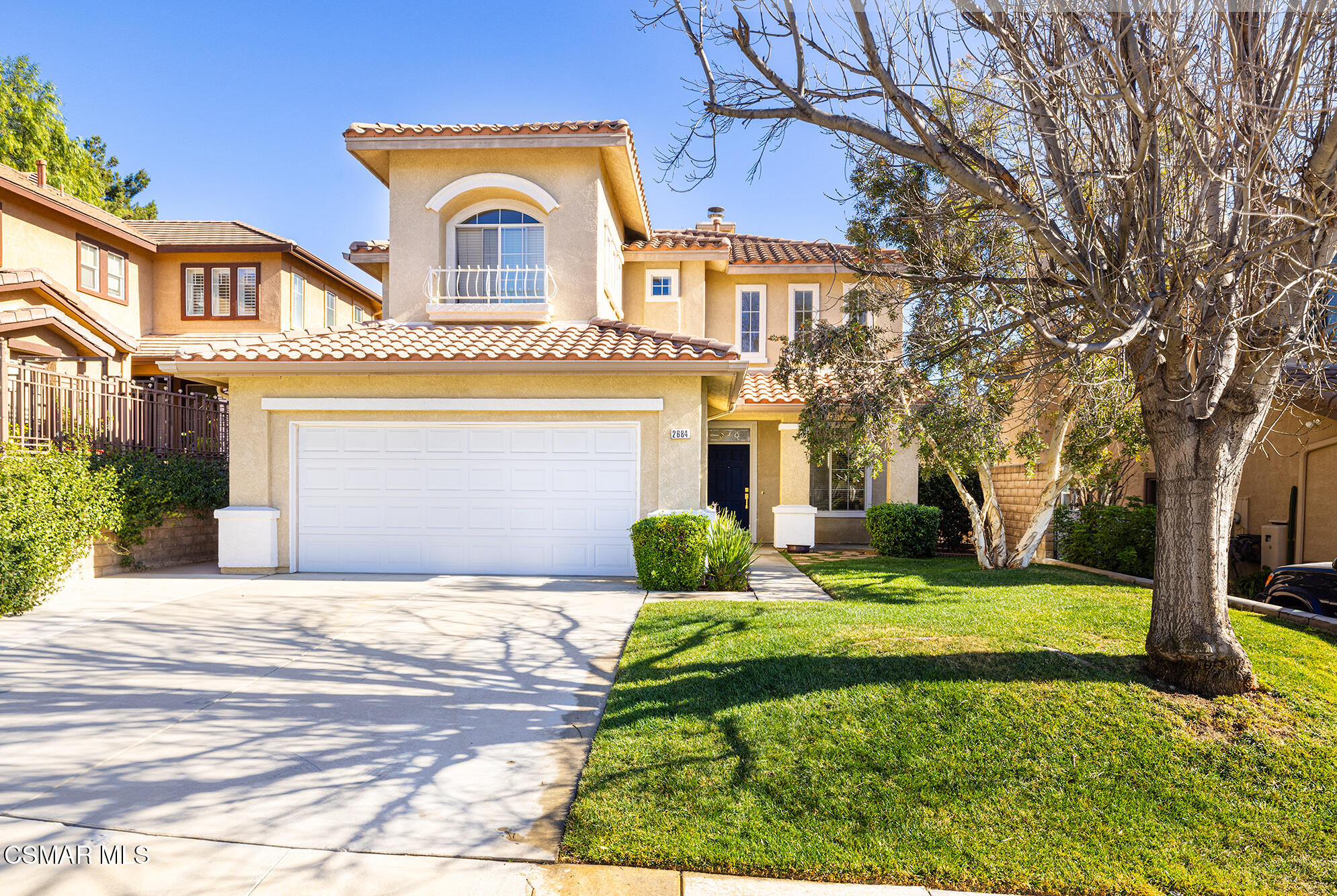 2684 Sunshine Valley Court Simi Valley, CA 93063 - Photo 3 of 38 a front view of a house with a yard and garage
