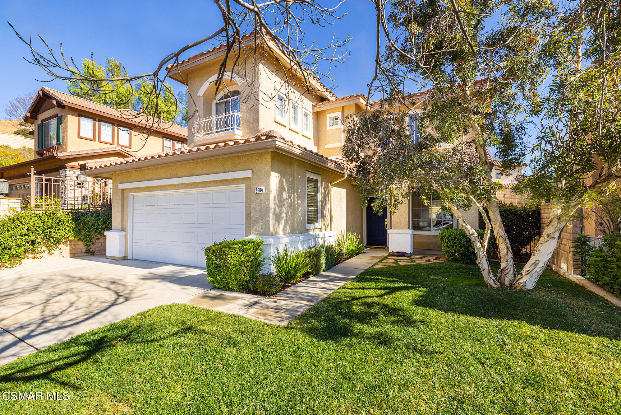 2684 Sunshine Valley Court Simi Valley, CA 93063 - Photo 5 of 38 a front view of a house with garden