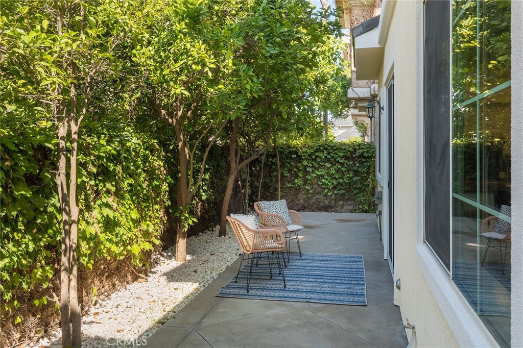 525 Fifth Avenue, Unit B Arcadia, CA 91006 - Photo 11 of 12 a chair and table sitting in front of a house