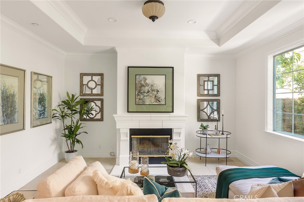 525 Fifth Avenue, Unit B Arcadia, CA 91006 - Photo 4 of 12 a living room with furniture a chandelier and a fireplace