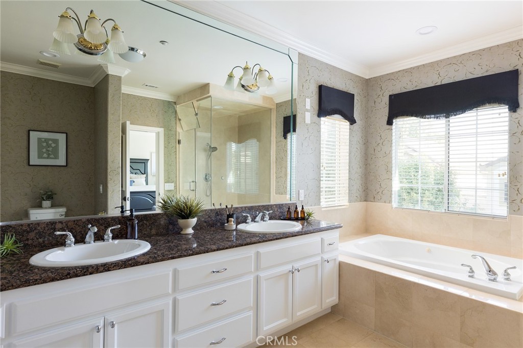 525 Fifth Avenue, Unit B Arcadia, CA 91006 - Photo 8 of 12 a bathroom with a granite countertop sink and a large mirror