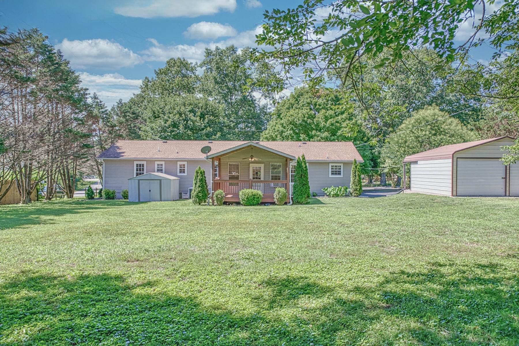 2085 Herbert Garrett Road Cookeville, TN 38506 - Photo 36 of 39 a front view of a house with a garden