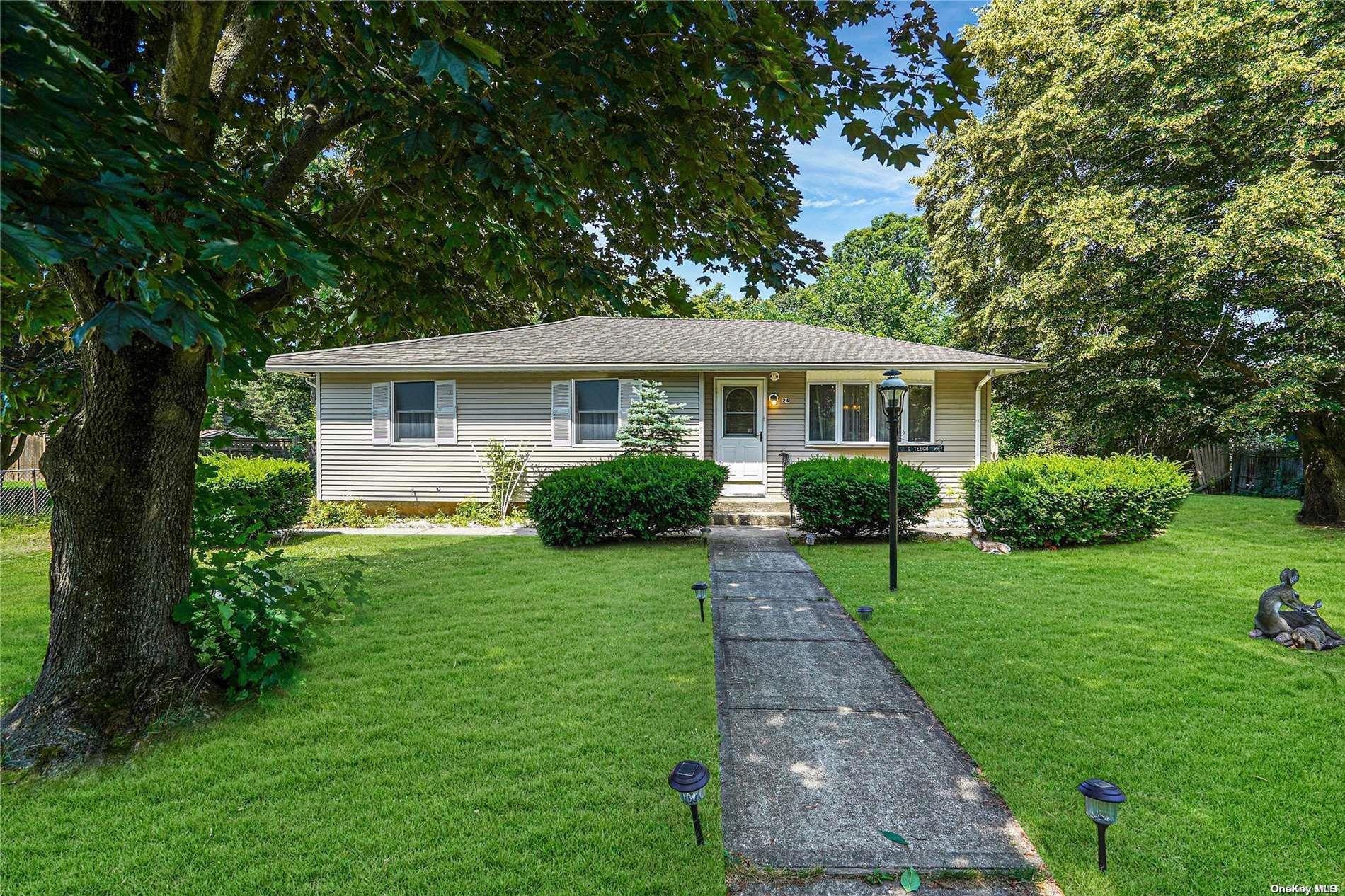 24 Pine Bark Road Ridge, NY 11961 - Photo 1 of 1 a front view of a house with a yard
