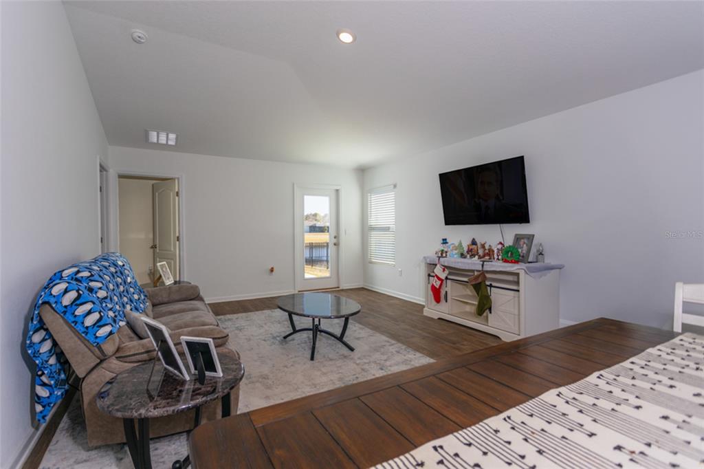 18 Bogey Place Bunnell, FL 32110 - Photo 12 of 40 a living room with furniture and a flat screen tv