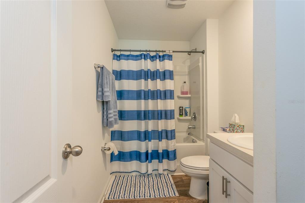 18 Bogey Place Bunnell, FL 32110 - Photo 17 of 40 a bathroom with a sink a toilet and shower