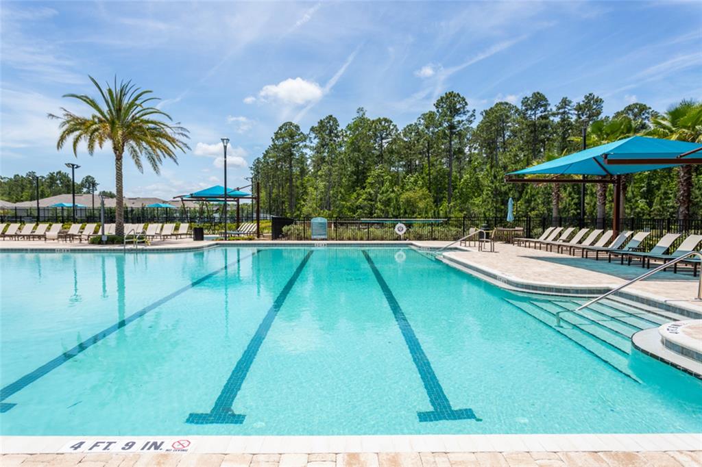 18 Bogey Place Bunnell, FL 32110 - Photo 35 of 40 a view of a swimming pool and lounge chair