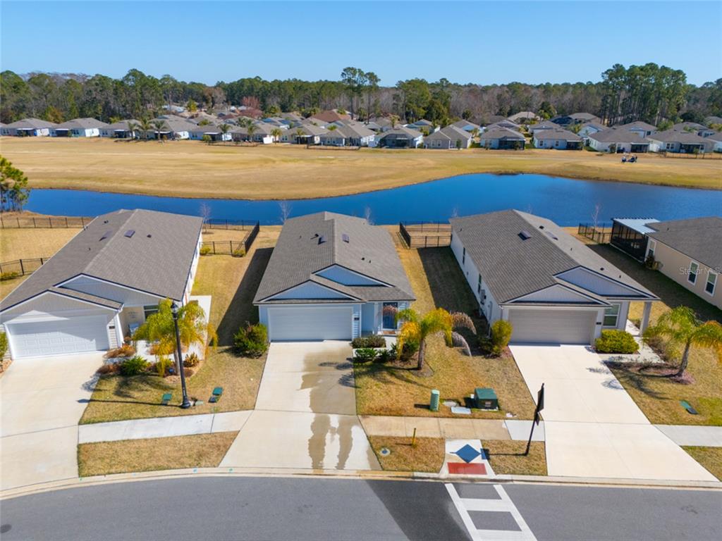 18 Bogey Place Bunnell, FL 32110 - Photo 6 of 40 an aerial view of a swimming pool and lake view