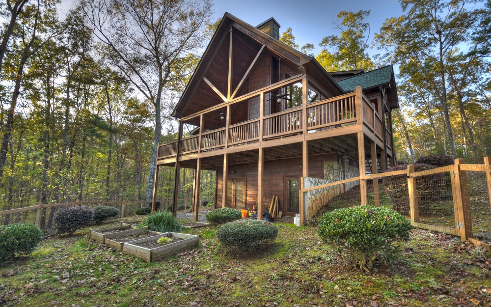 124 Chestnut Hills Lane Blue Ridge, GA 30513 - Photo 1 of 1 a house view with a garden space