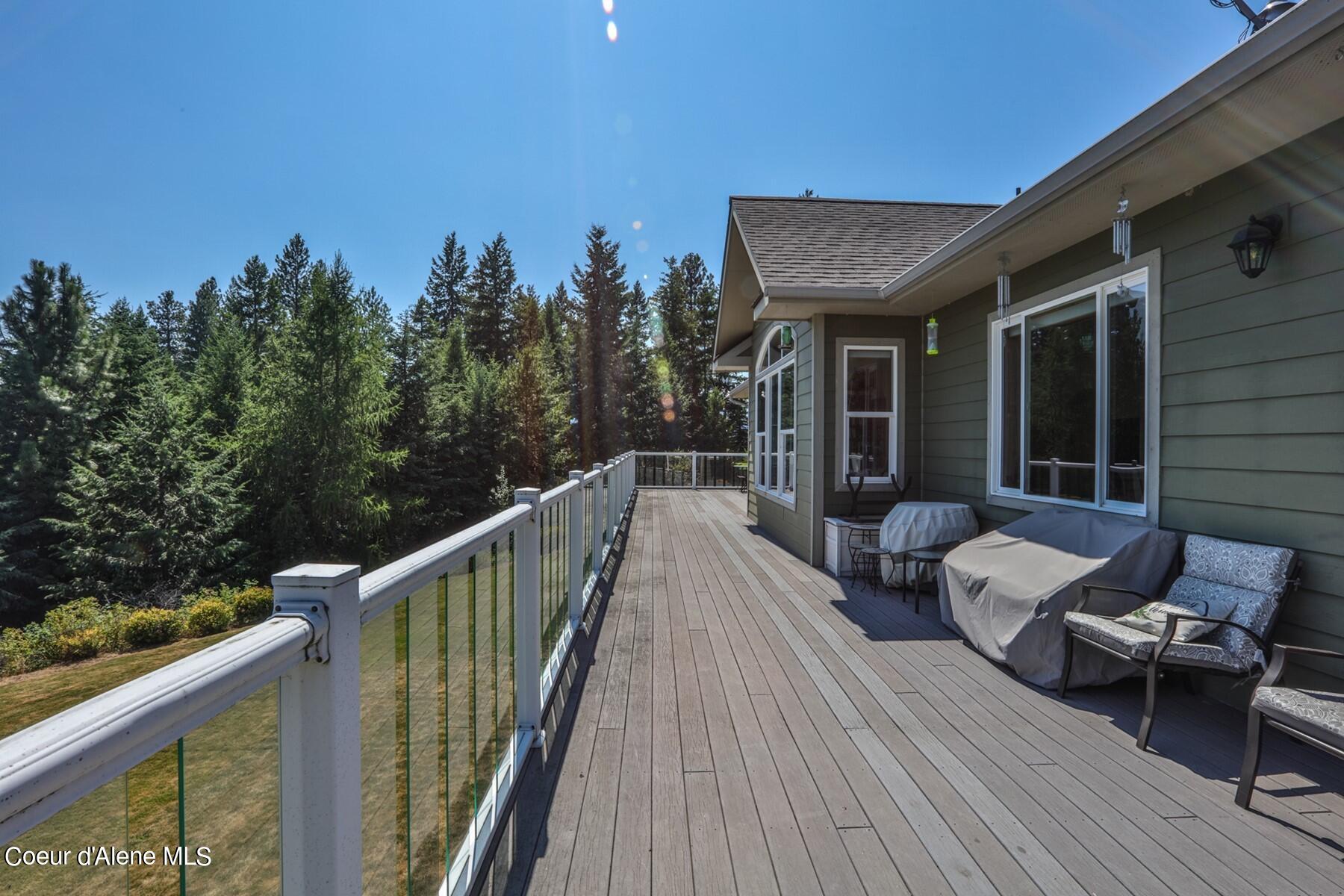 1524 Sunrise Road Bonners Ferry, ID 83805 - Photo 19 of 49 Deck wraps around back of home