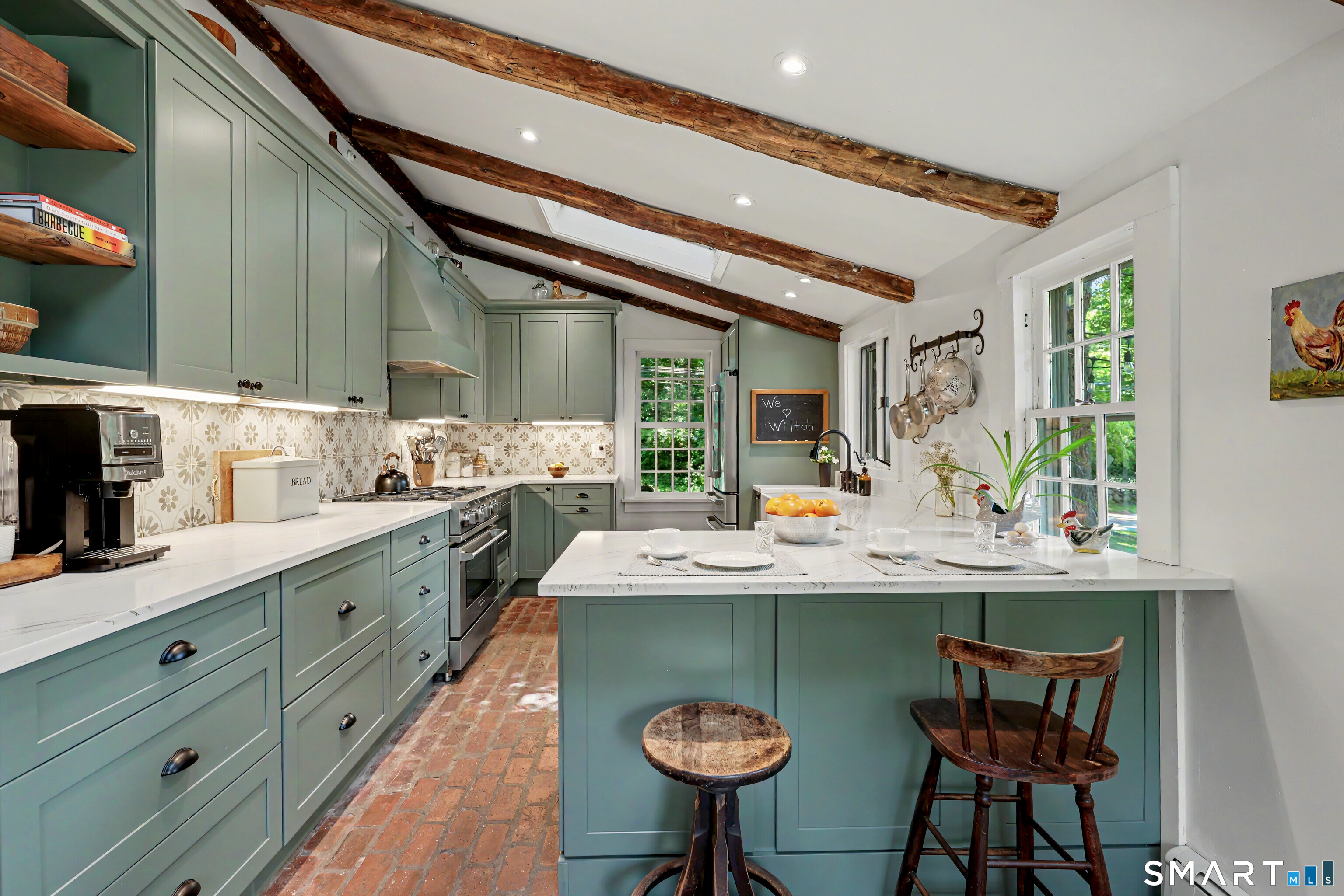 183 Range Road Wilton, CT 06897 - Photo 13 of 40 Newly renovated chef's kitchen with breakfast bar