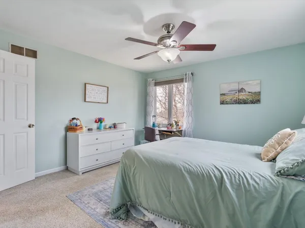 a bathroom with a sink vanity granite shower and a mirror