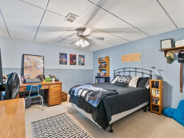 a bathroom with a sink vanity mirror and toilet