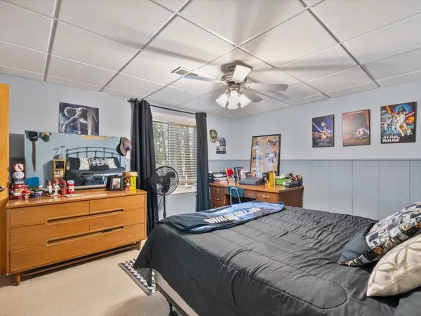 a roof deck with table and chairs and wooden floor