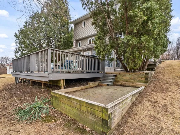 a view of a house with brick walls
