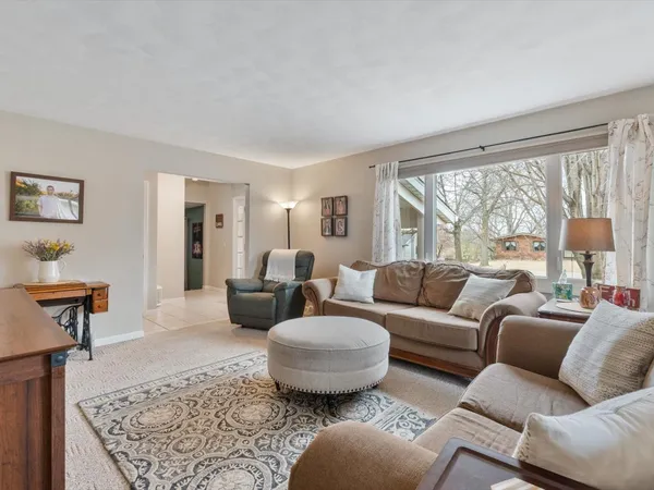 a living room with furniture and a rug