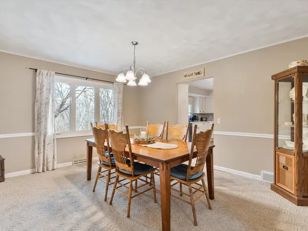a view of a dining room with furniture window and outside view