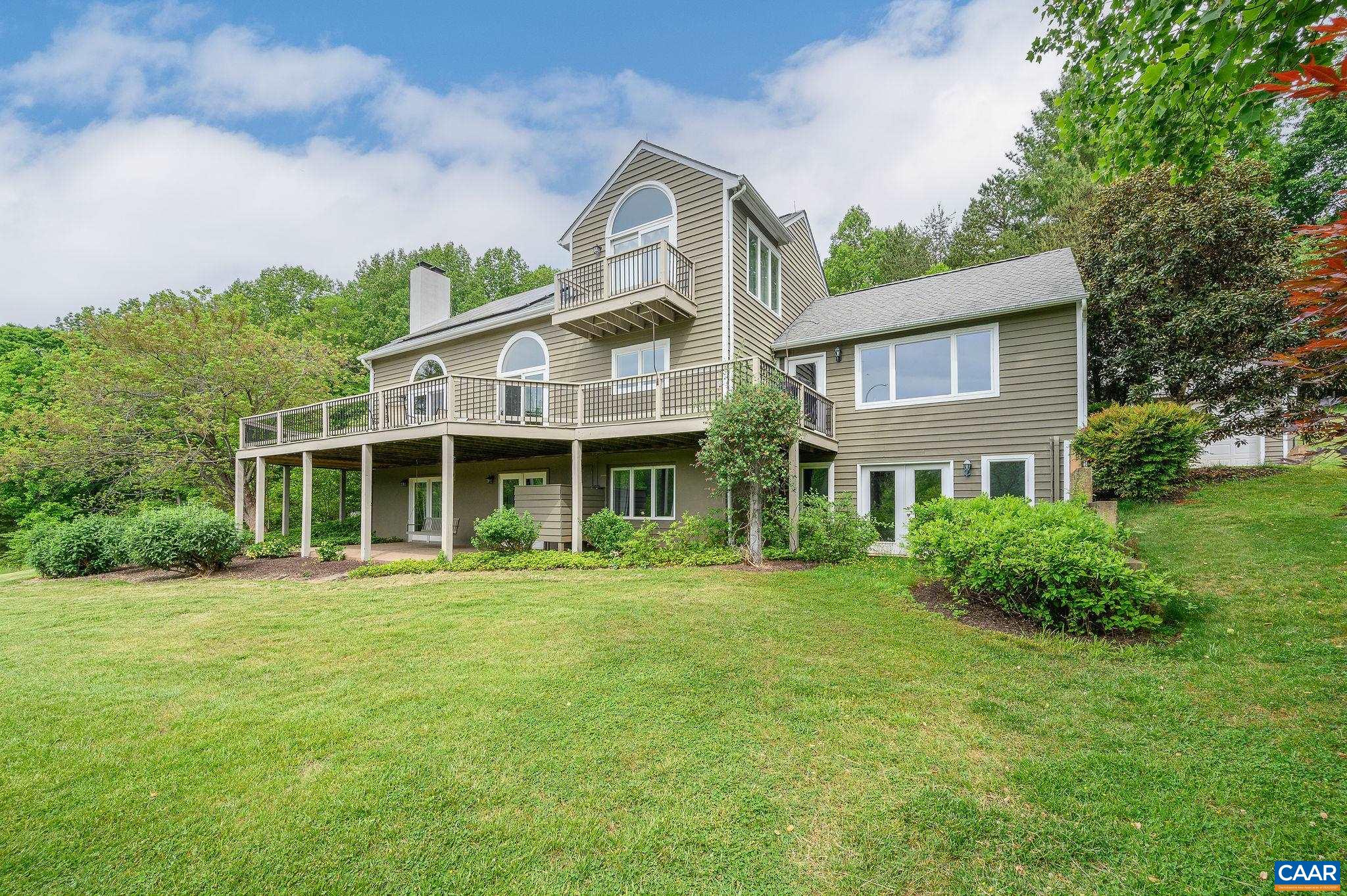 888 Wolf Trap Road Charlottesville, VA 22911 - Photo 1 of 63 a front view of a house with a garden