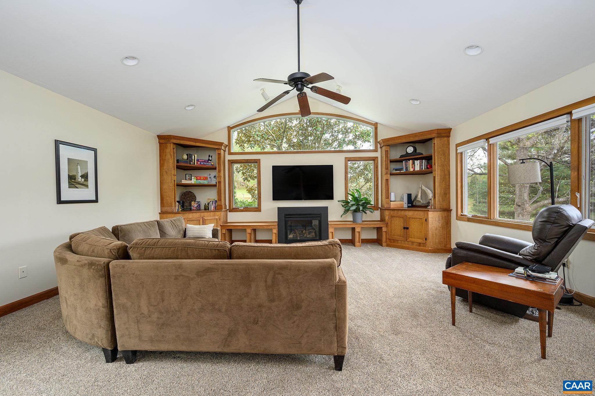 888 Wolf Trap Road Charlottesville, VA 22911 - Photo 11 of 63 a living room with furniture and a flat screen tv