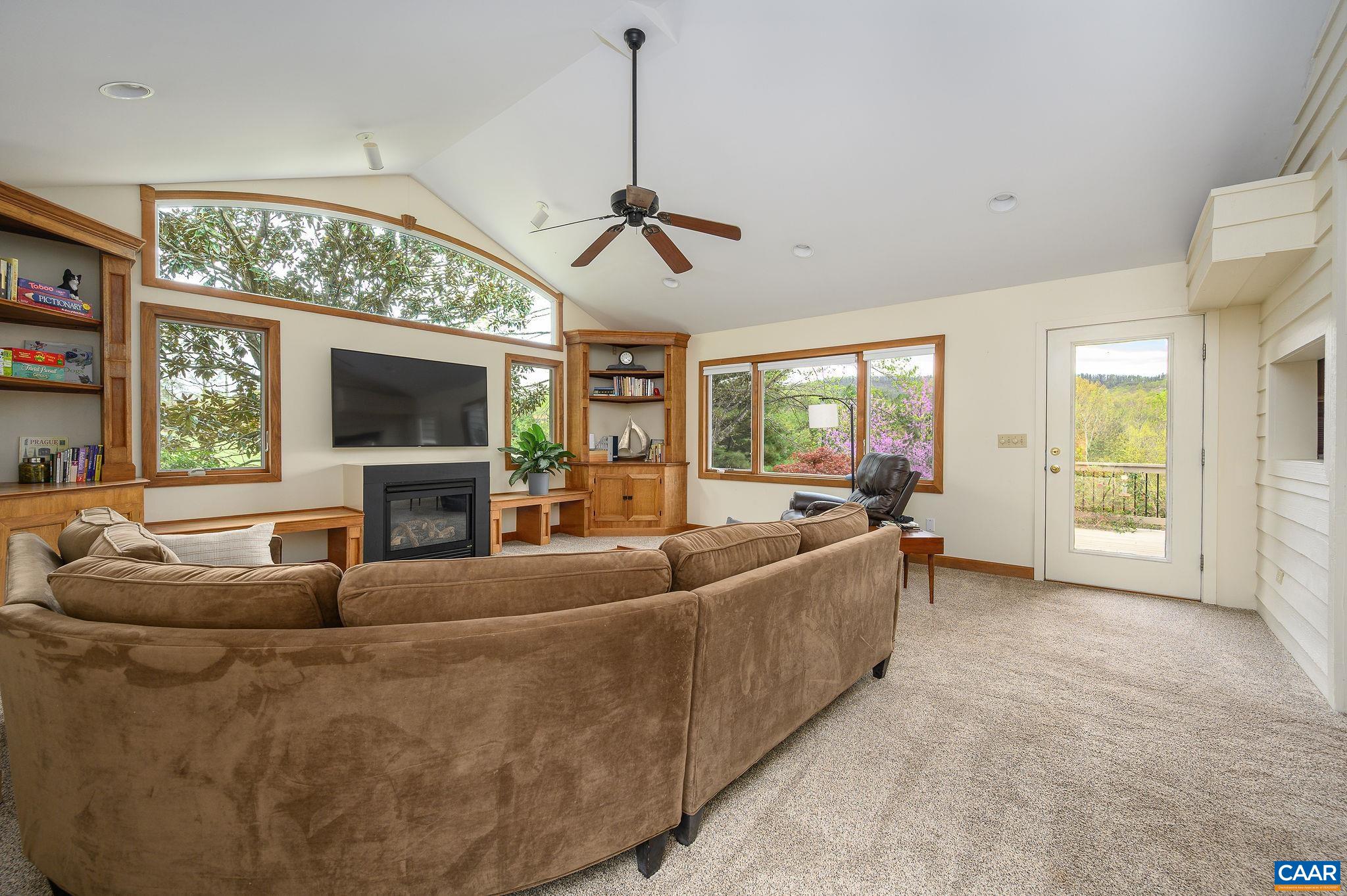 888 Wolf Trap Road Charlottesville, VA 22911 - Photo 12 of 63 a living room with furniture and a flat screen tv