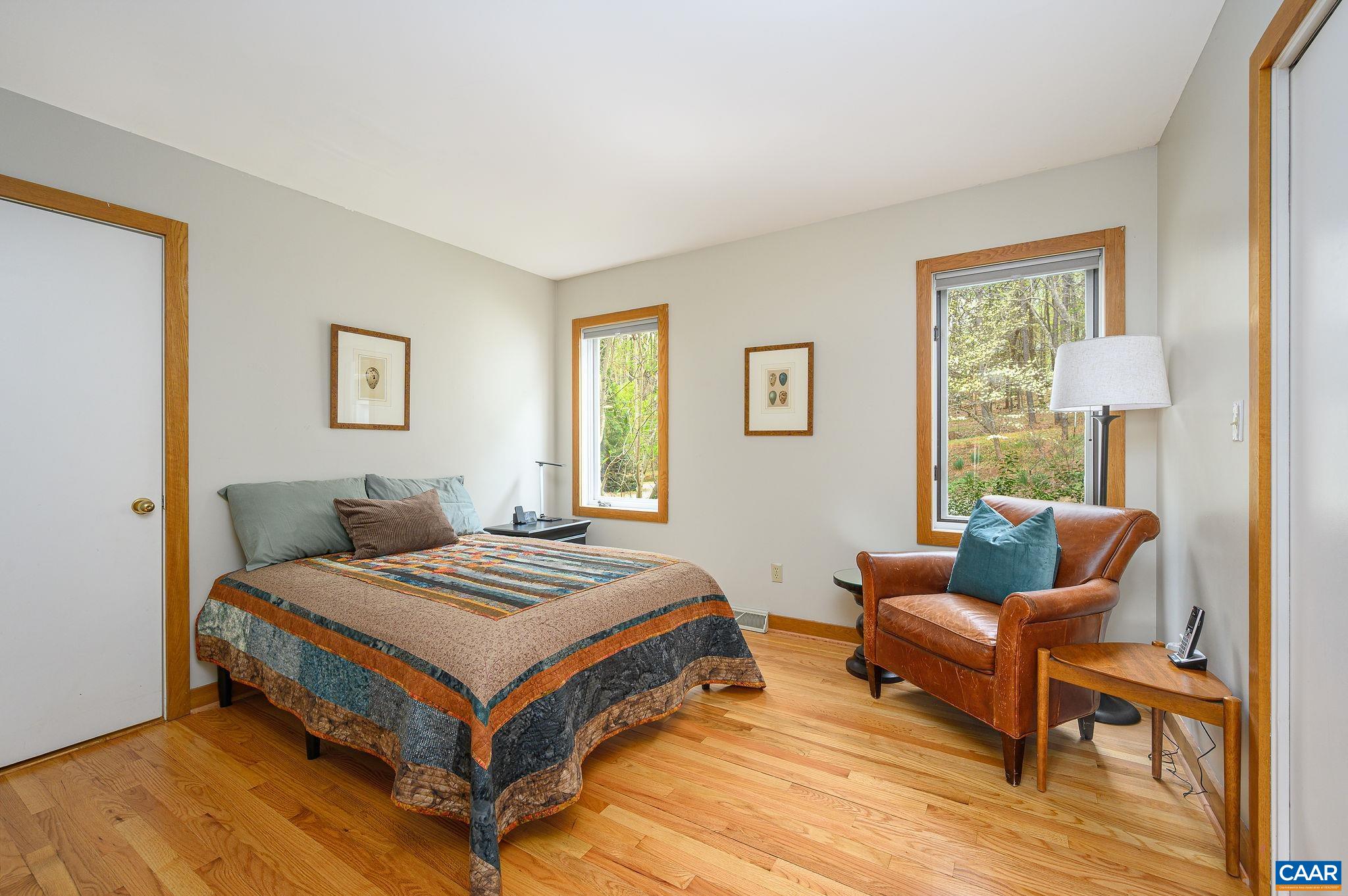 888 Wolf Trap Road Charlottesville, VA 22911 - Photo 14 of 63 a bedroom with a bed and a couch