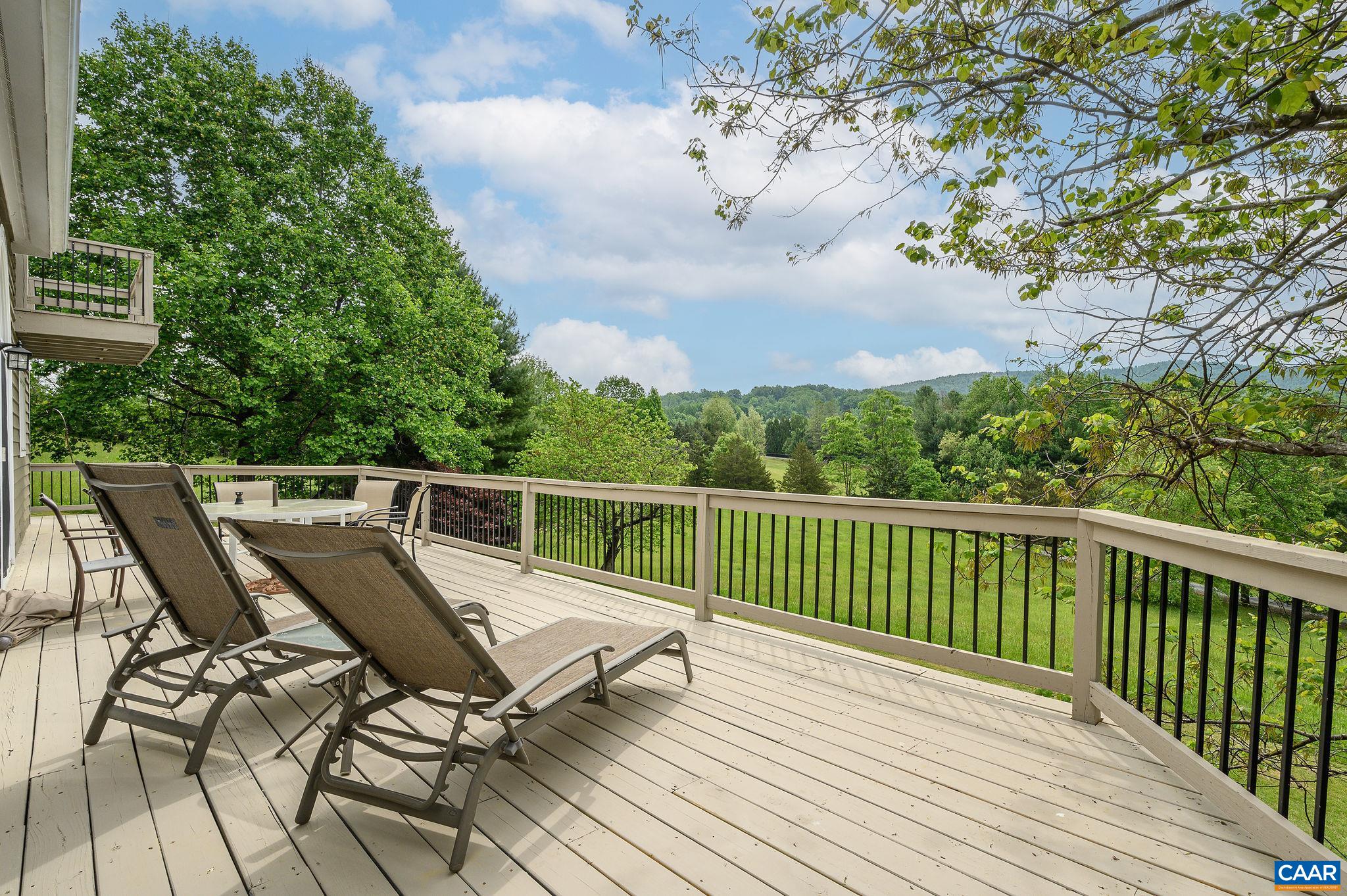 888 Wolf Trap Road Charlottesville, VA 22911 - Photo 2 of 63 a view of a chairs on th deck