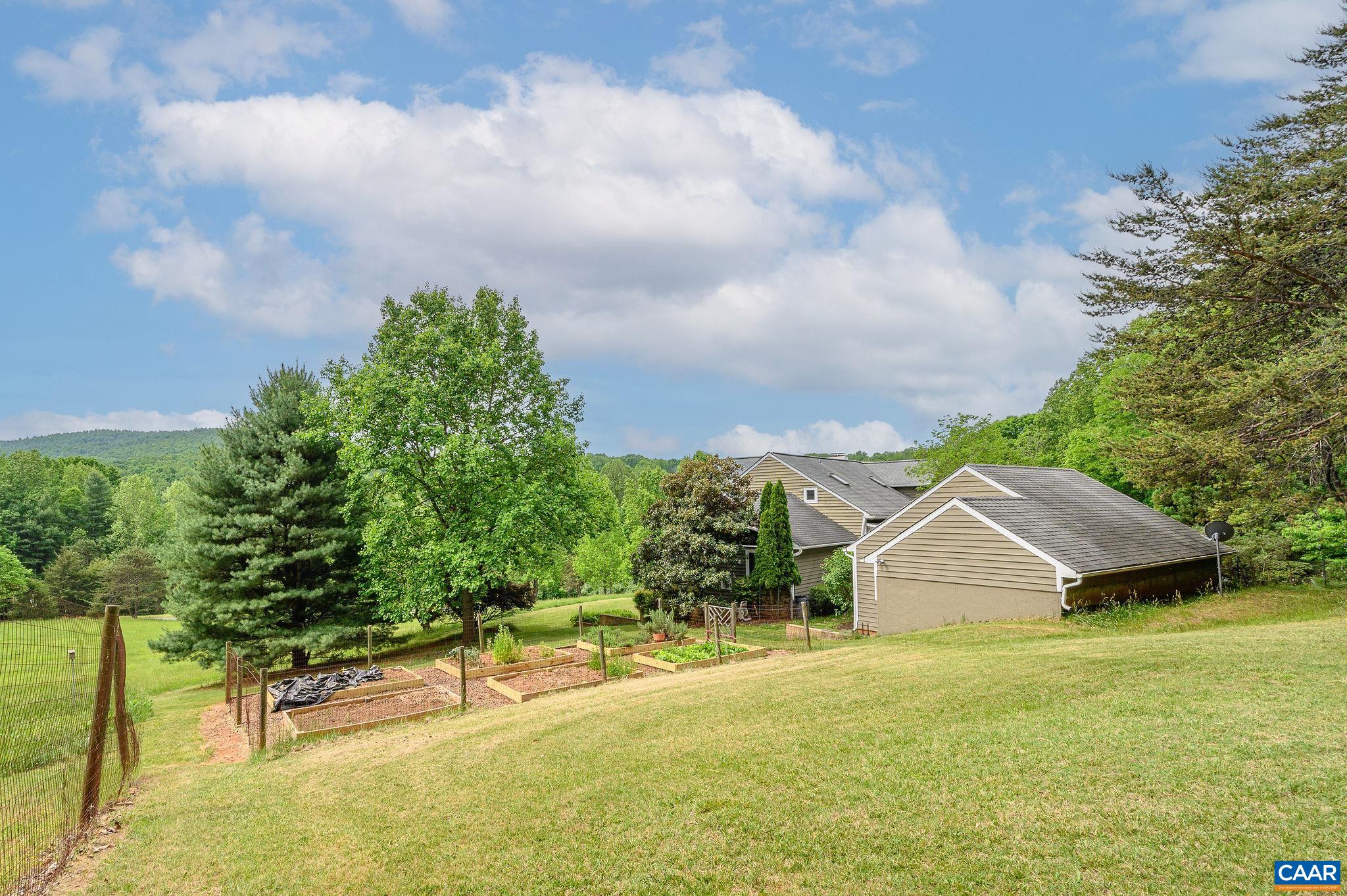 888 Wolf Trap Road Charlottesville, VA 22911 - Photo 41 of 63 a view of a house with a yard and sitting area