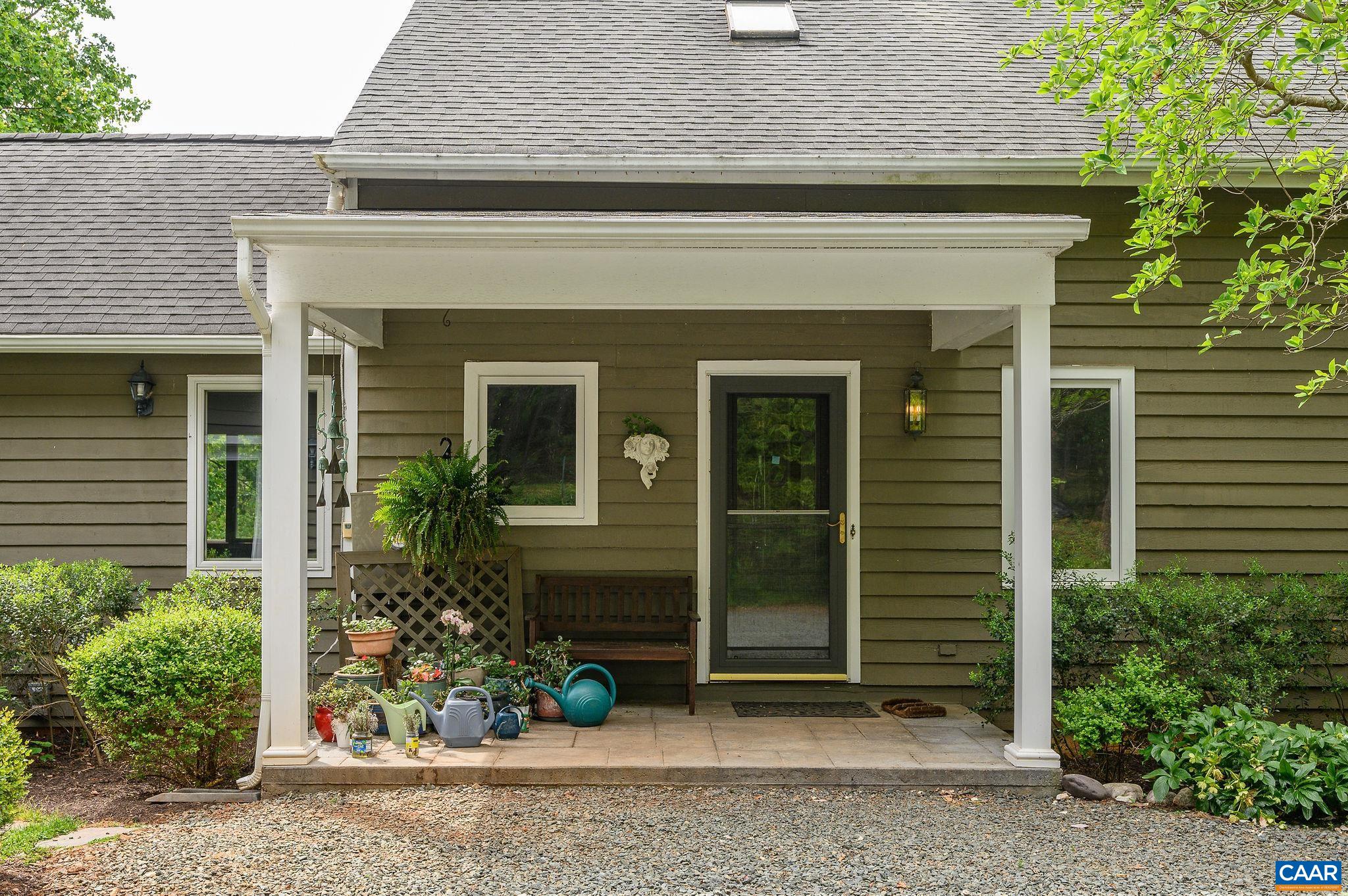 888 Wolf Trap Road Charlottesville, VA 22911 - Photo 50 of 63 a front view of a house with plants