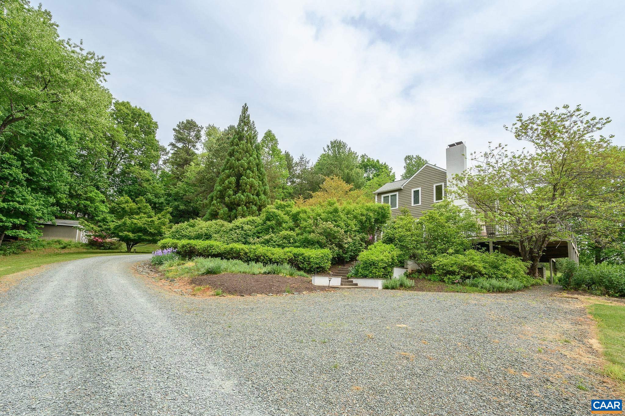 888 Wolf Trap Road Charlottesville, VA 22911 - Photo 55 of 63 a view of a garden with plants and large trees