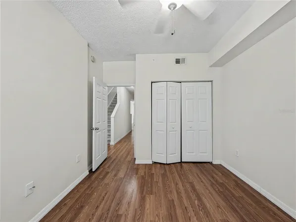 a view of hallway with wooden floor