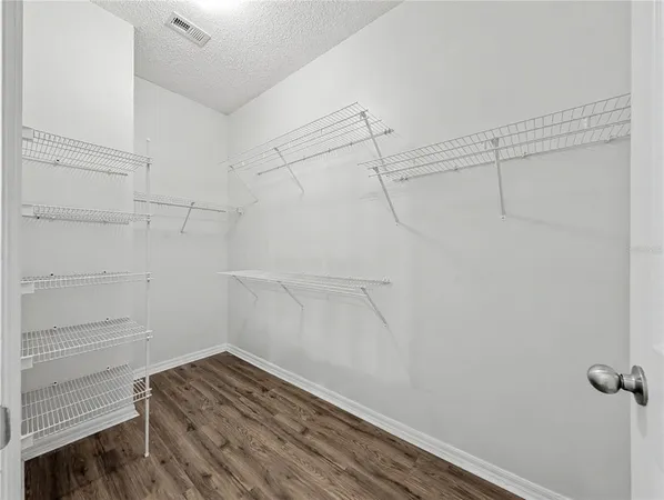 a view of a room with racks on the wall