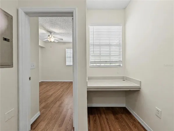 a view of front door with wooden floor
