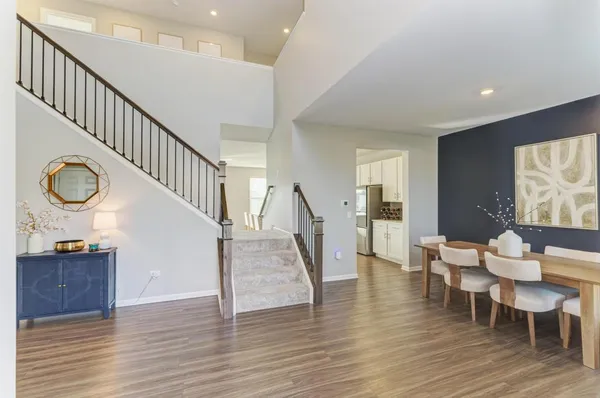 a view of a livingroom with furniture and stairs