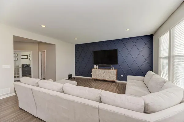 a living room with a couch and a flat screen tv
