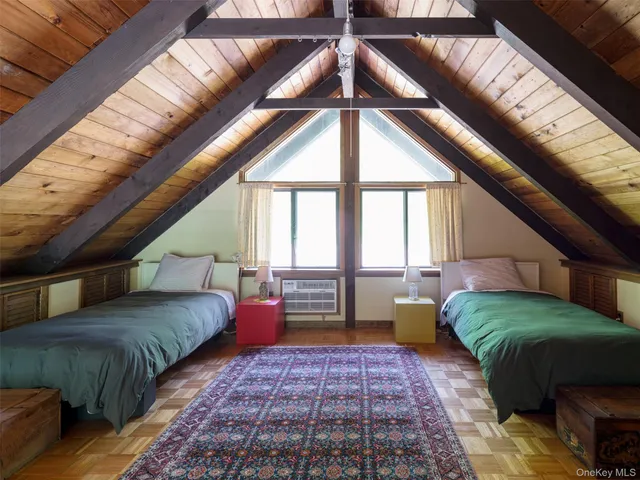 a bedroom with bed and a window