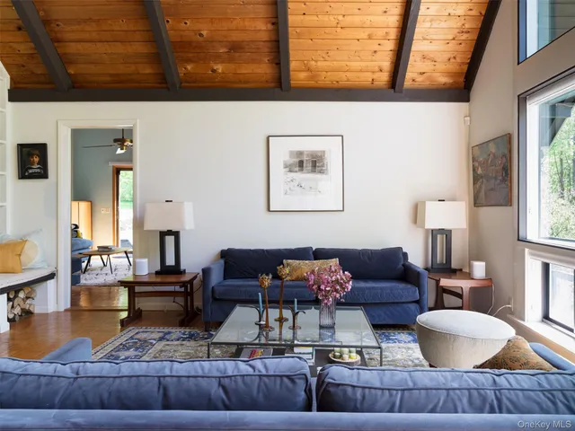 a living room with furniture and a table