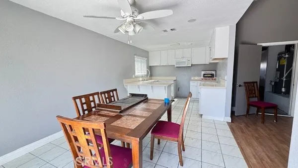 a view of kitchen with cabinets and wooden floor